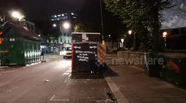 A comical sign on the toilets at the Notting Hill Carnival, also footage shows the very broken urinals