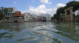 Shooting buildings around Malacca town by boat