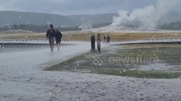 Unbelievable weather in Yellowstone's Old Faithful as rain downpours
