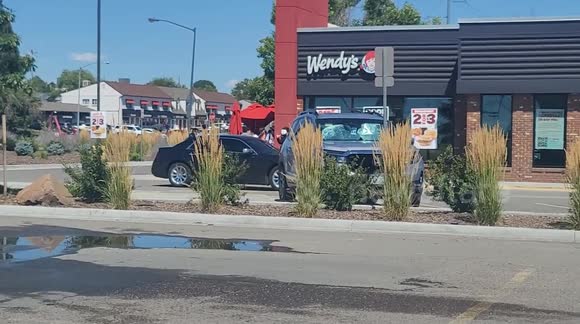 An amicable boxing fight by 2 teenagers outside Wendy's.