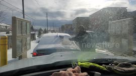 Canadian Clears Off Snow Covered Car