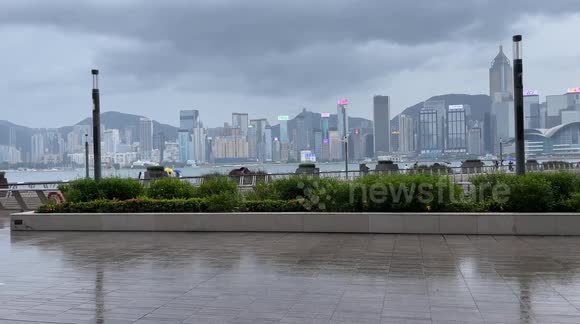 Eerie atmosphere on Avenue of Stars in Hong Kong where music plays and people take selfies during Super-Typhoon Saola