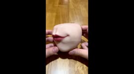 Tomie's mouth coin purse: coin-chomping creation of a human flesh artist