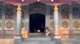 Vaishnava priest waiting for devotee at Barpeta Kirtanghar or Namghar in Barpeta village in Northeastern state Assam in India.