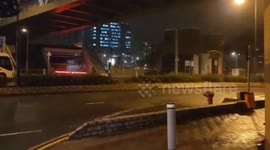 Woman blown across ground during Typhoon Saola in Hong Kong