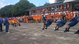 Philippine Navy officers compete with Marine corps in tug-of war at military sports cup