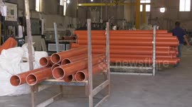 Palestinians working in a plastic factory in Gaza city. Israel said on Monday it was temporarily stopping commercial goods from leaving the Gaza Strip through a main border crossing after security officers thwarted an attempt to smuggle out explosives.