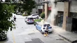 Falling bricks narrowly miss mother and child in China