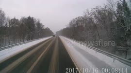 Car Slides on Snow and Gets Hit by Semi (ID: 161410514)