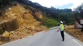 Police officer halts traffic moments before mountain's dramatic collapse in China