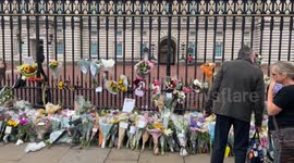 Archival: People pay tribute to the late Queen Elizabeth II outside Buckingham Palace in London
