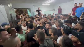Relatives mourn over the body of Palestinian Milad Al-Ra'i, killed by israeli security forces, at the morgue, in Al-Aroub refugee camp, north of the West Bank city of Hebron