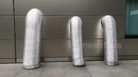 Children get surprised by giant Slinky's in Broadgate Circle in the City Of London. Part 9f the Bartholomew Fair