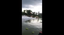 Drag boat flips over during high-speed race on canal