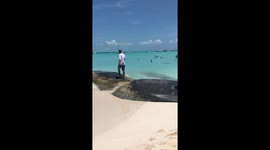 Guy Slips and Falls Into Water While Trying to Propose
