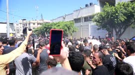 Palestinians carry the body of Mohammed Qadom, who was killed during an explosion near the border fence with Israel, during his funeral in Gaza City.