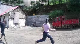 Cement mixer tumbles down hill crushing family's home in China