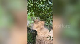 Mountain runoff surges down waterfalls sending hikers fleeing in the Philippines