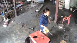 Mother falls off wobbly chest box she uses as platform to reach ceiling