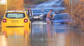 Man strips down to underwear in an attempt to recover a stranded vehicle in Storm Franklin flooding in Yorkshire,UK