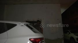 Palestinians inspect the damage caused by during an Israeli army assault in the West Bank city of jenin