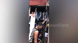 Friends use rope to send beer up to man when wife stops him leaving