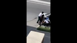 Officers dismissed after footage emerges of them bundling woman and her baby into vehicle