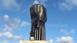 Palestinians and militants from the Palestinian factions participate in the opening of the memorial commemorating the 18th anniversary of the Israeli withdrawal from the Gaza Stripa