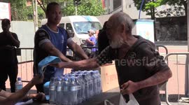 Water bottles of water and fruit handed out as heatwave strikes Brazil