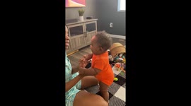 Adorable baby boy pretends to shout for the Lord to reciprocate mom's energy