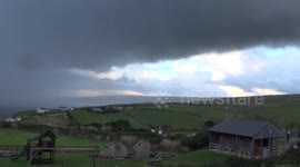 Freaky Rain cloud over Port Isaac bay, it blacks out the sky  and makes it go dark, i had to turn the lights on.
