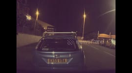 Man Runs Across Car's Roof