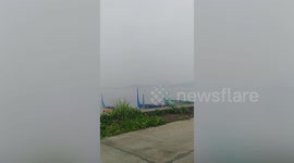 Taal Volcano smog blankets nearby towns and drifts toward Manila in the Philippines