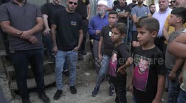 Palstinians carry the body of Bilal Qadah, 33, during his funeral in the West Bank city of Ramallah