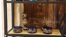 Palestinians attend a handmade glass making exhibition in the Old City of the West Bank city of Hebron.