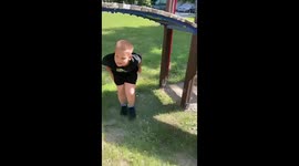 Ukrainian child's roundabout play amidst ruins: a harrowing portrait of conflict's toll