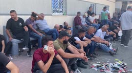 Palestinian workers wait at the Erez crossing as they prepare to leave Beit Hanun in the northern Gaza Strip, to go to work inside Israel.