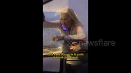 Bizarre moment 'very crazy' woman climbs car and chases people in Cordoba, Argentina