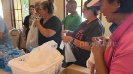 Spreading Smiles and Groceries: Adam and Angels' Heartwarming Assembly Line Dance at Santa Barbara Church