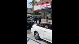 Guy tries to steal wine from 7/11 on willow and pacific in Long Beach ca