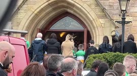 Coffin carried out of church after funeral of Ronan Wilson in Cookstown, UK