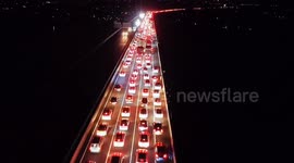 Holiday traffic surge transforms expressway into 'dragon of lights’ amid China's dual festivities