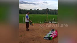 Paramotor fail! Doll crashes straight into bamboo pole