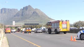 Police vehicle crushed as container truck overturns on National Road in Cape Town