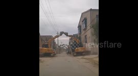 Bridegroom build arch with 18 excavators to celebrate his wedding