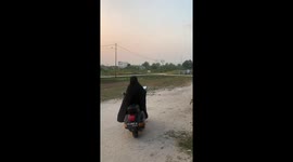 Child bumps into lady on motorbike in Palangkaraya city, Indonesia