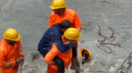 Metal panels used to transport locals across thick mud as floods wreak havoc in northern India