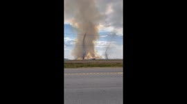 Rare moment two fiery dust devils spotted burning over farmland