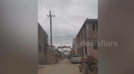 Groom uses 18 excavators to make wedding arch in China
