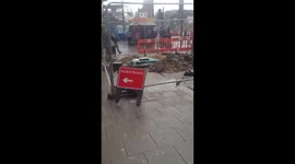 man walks by construction site